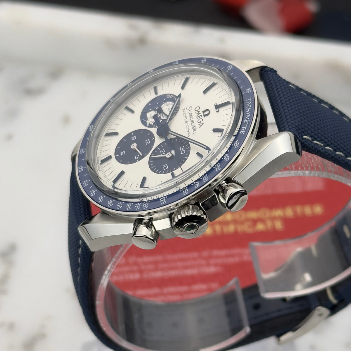 2026 Omega Speedmaster "Silver Snoopy Award" 50th Anniversary | 310.32.42.50.02.001 | Box & Papers